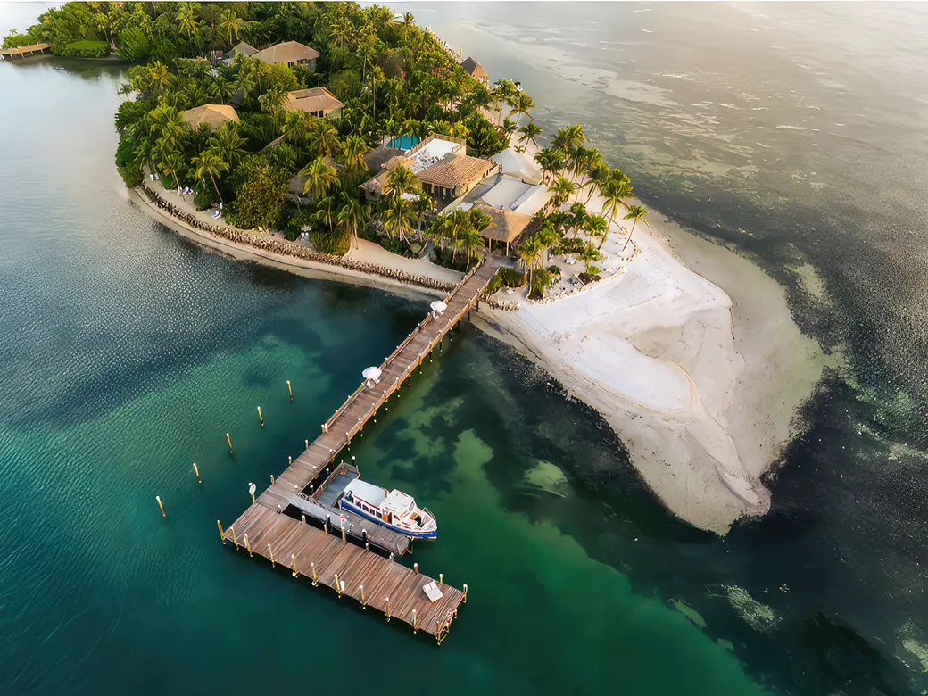 An aerial view of Little Palm Island with a boat docked