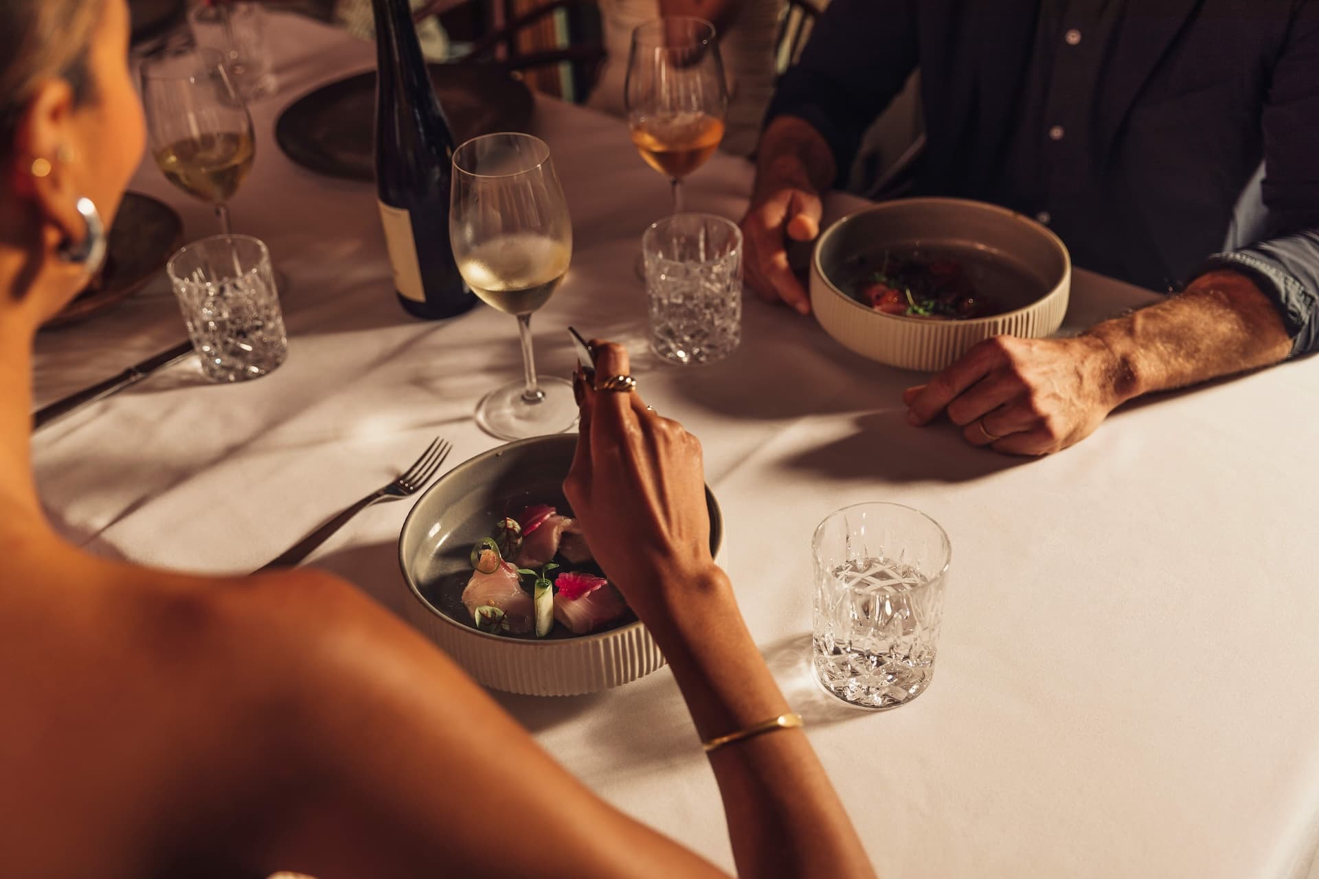 A group enjoying a private dining experience at Little Palm Island Resort