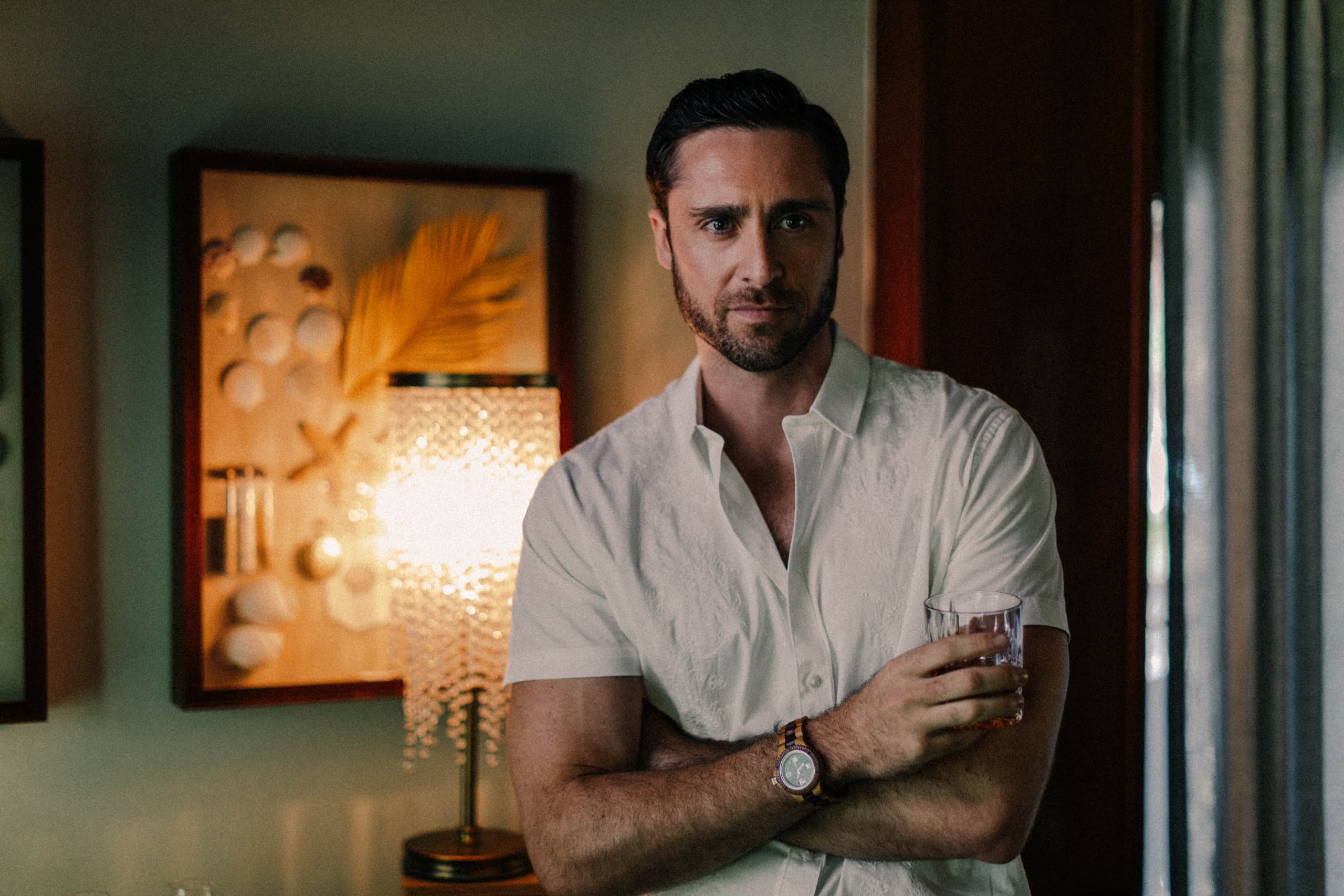 A man wearing the men's apparel from Little Palm Island