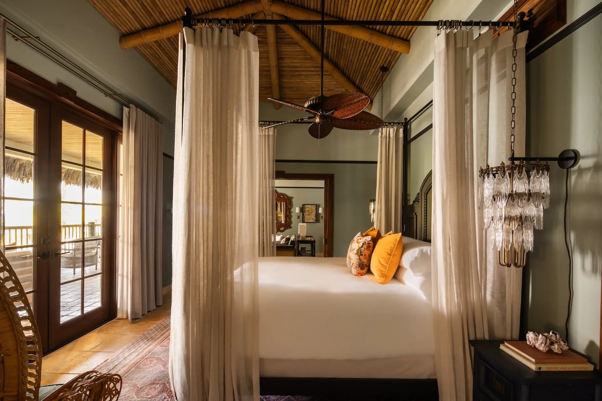 A bedroom at Little Palm Island with a canopy surrounding the bed