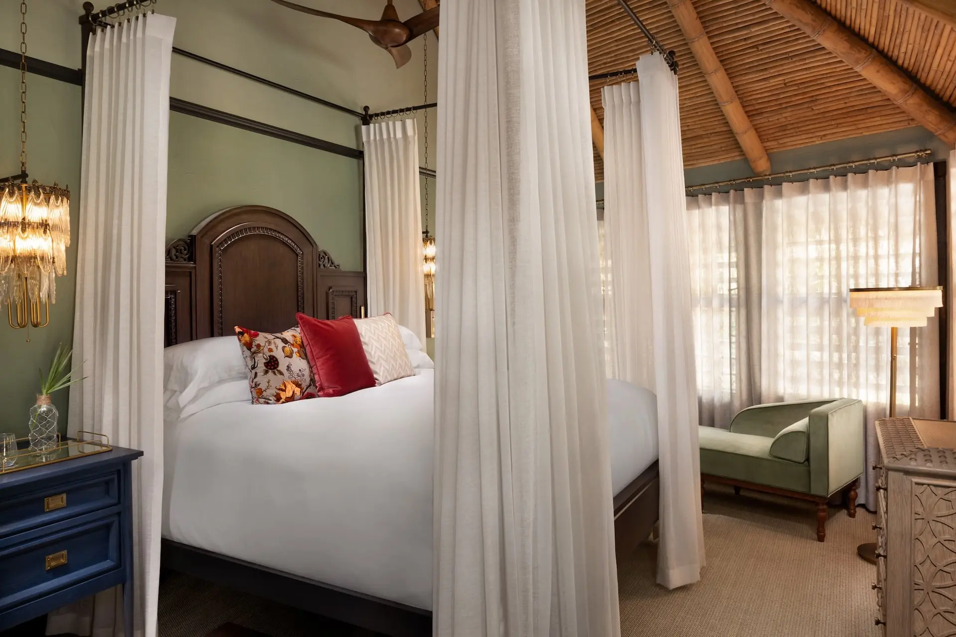 A canopy over the bed inside the Island Escape Suite