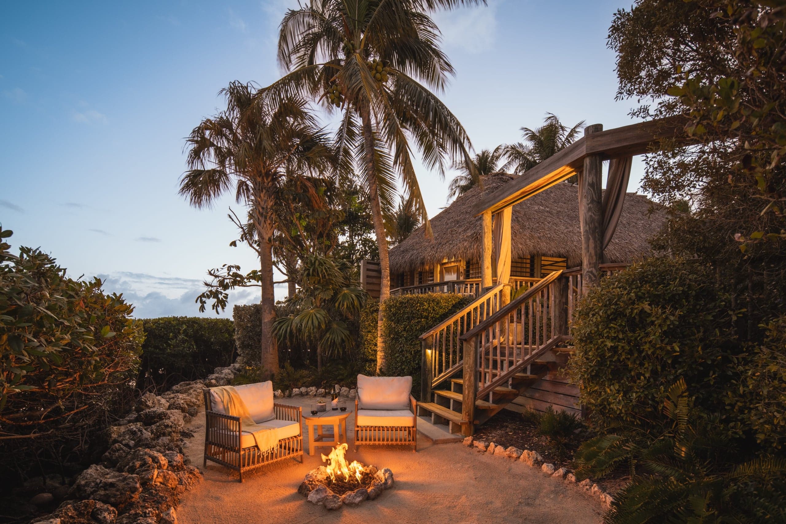 An outdoor fire pit outside a Premier Suite at Little Palm Island Resort