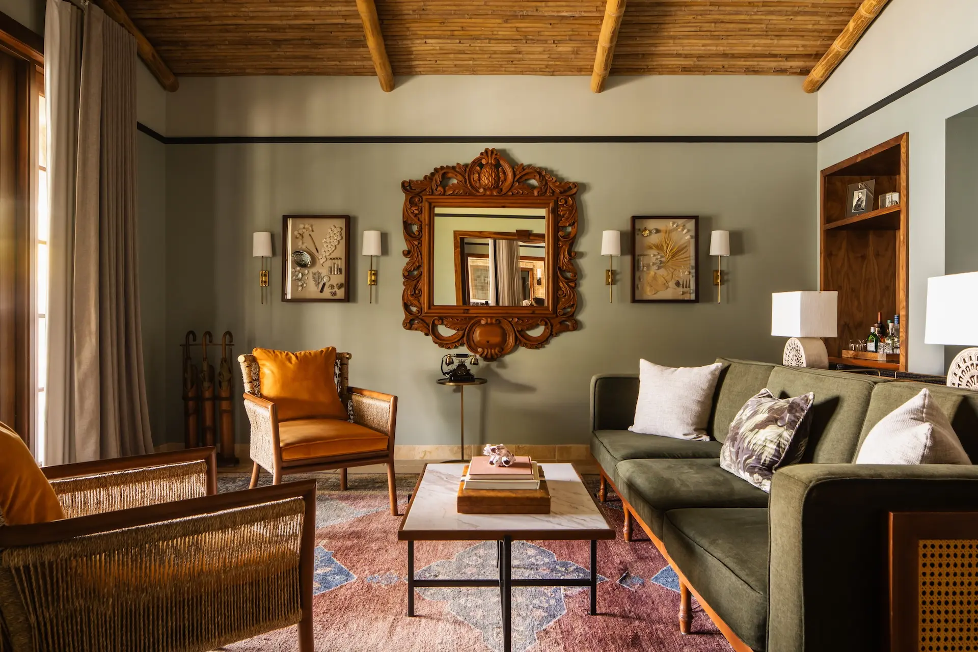 The living space of a room at Little Palm Island with a beautiful sofa and two chairs