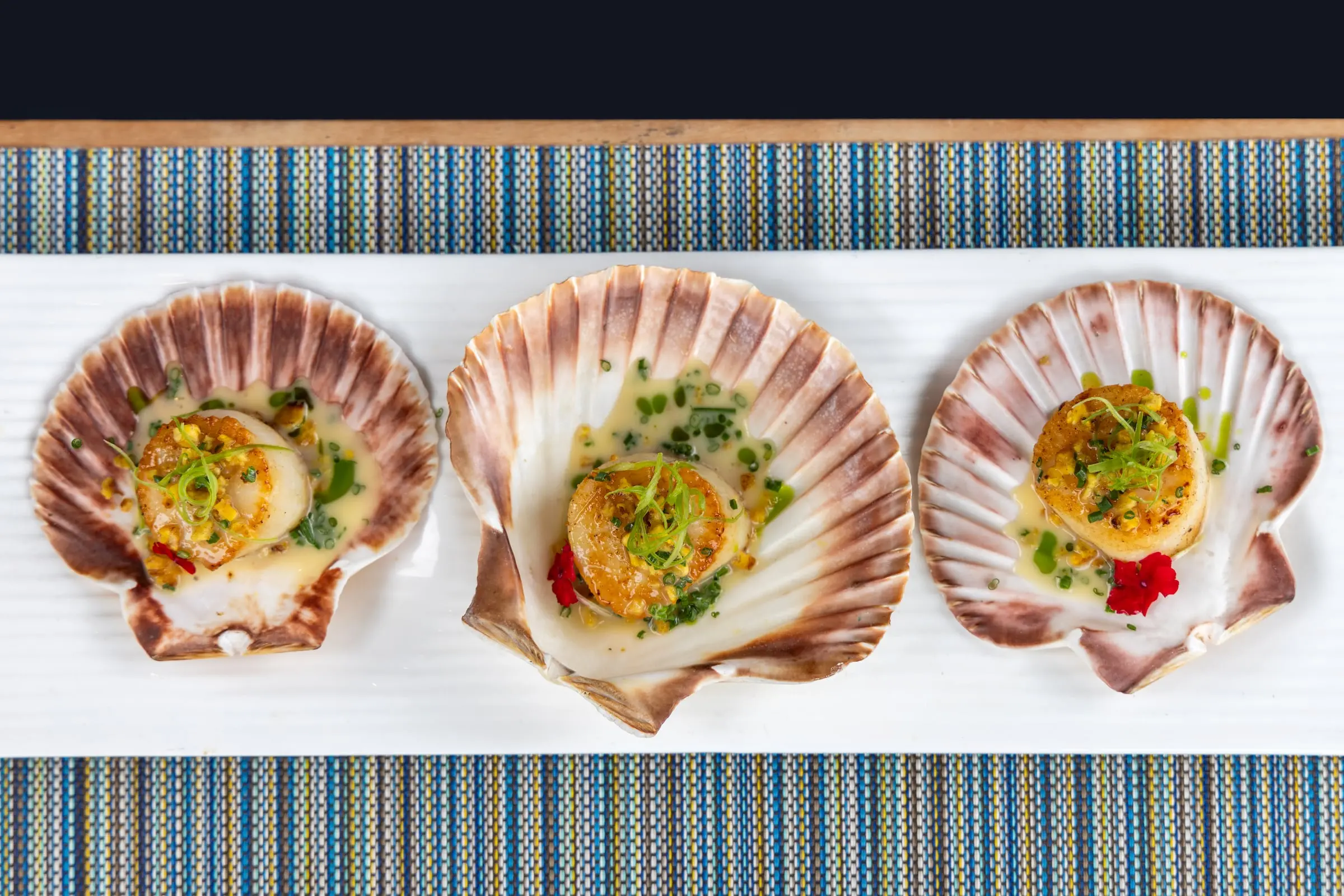 An overhead shot of an appetizer served from the Chef's Tasting Menu