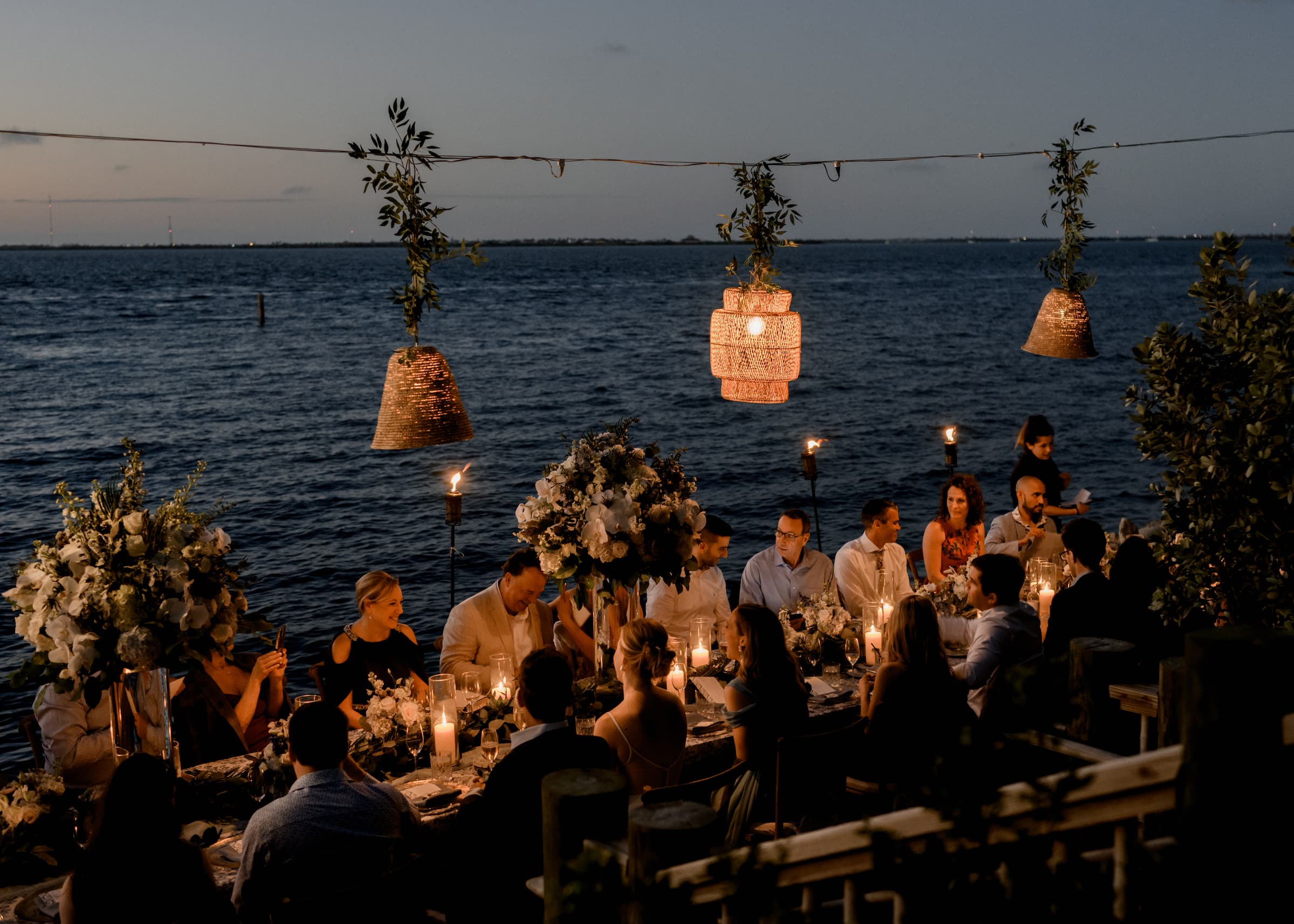 An elegant oceanfront group dining event on the beach at Little Palm Island Resort