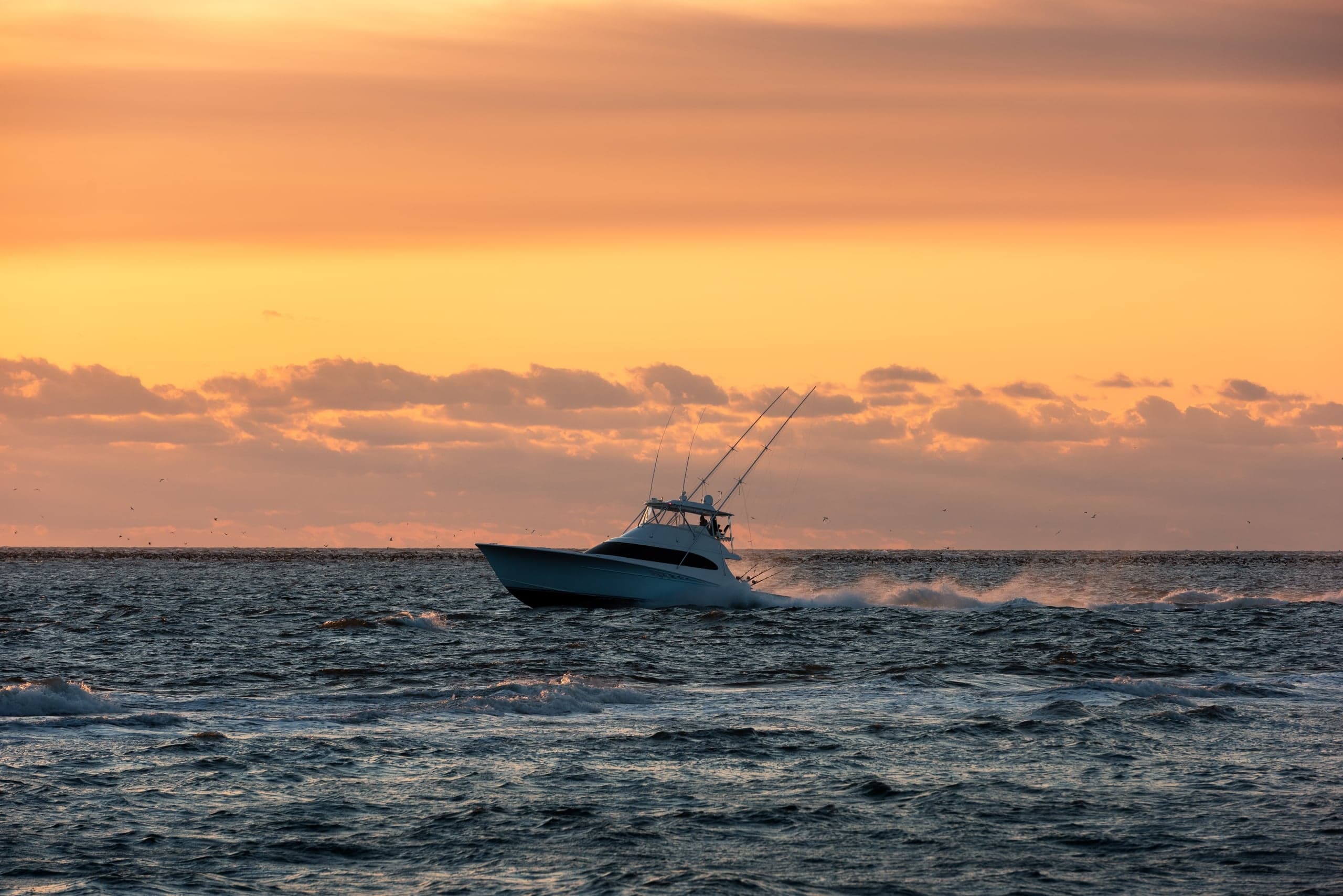 A chartered fishing boat cruising around Little Palm Island