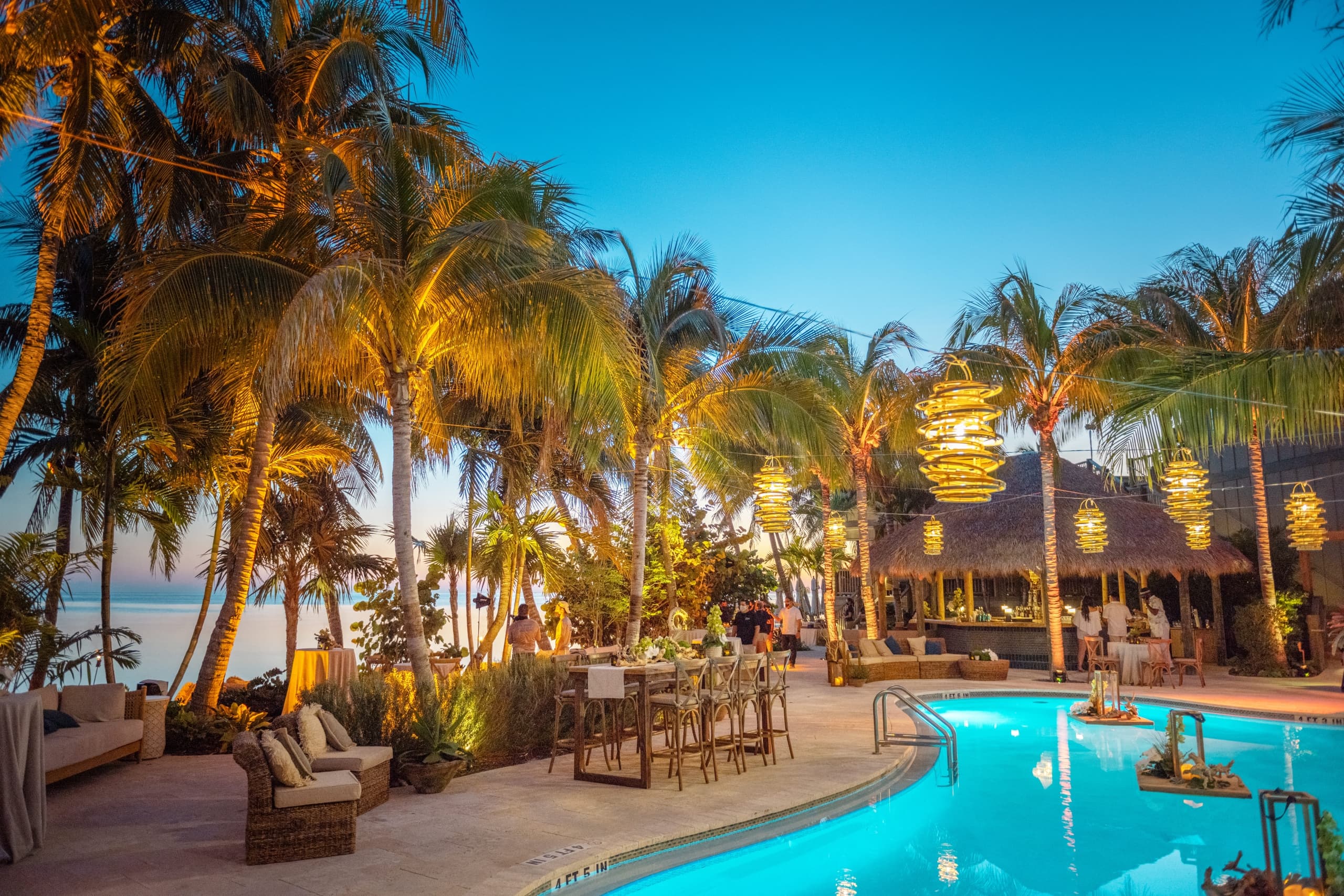 The oceanfront outdoor pool and tiki bar at Little Palm Island Resort.