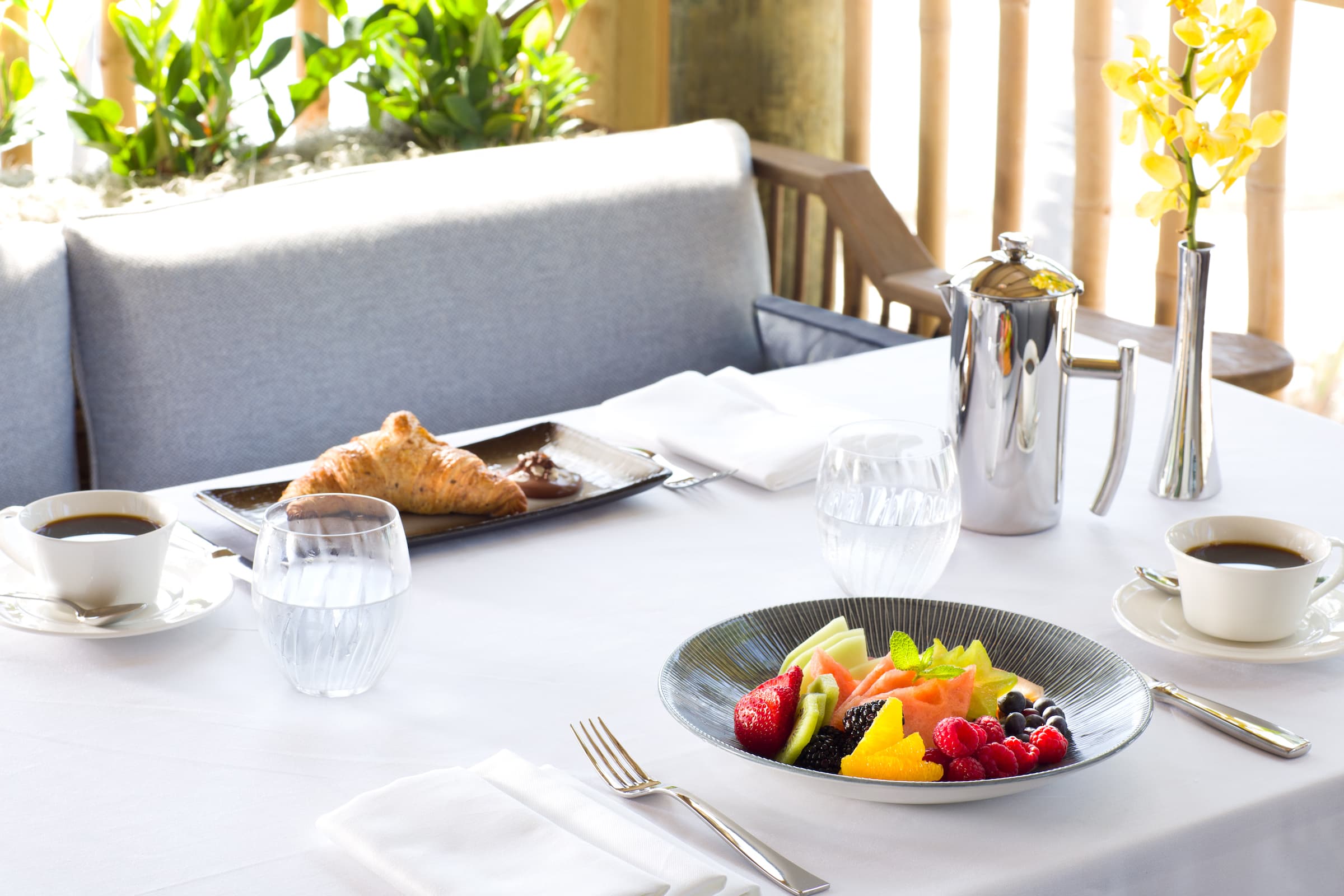 Breakfast food on a table for two