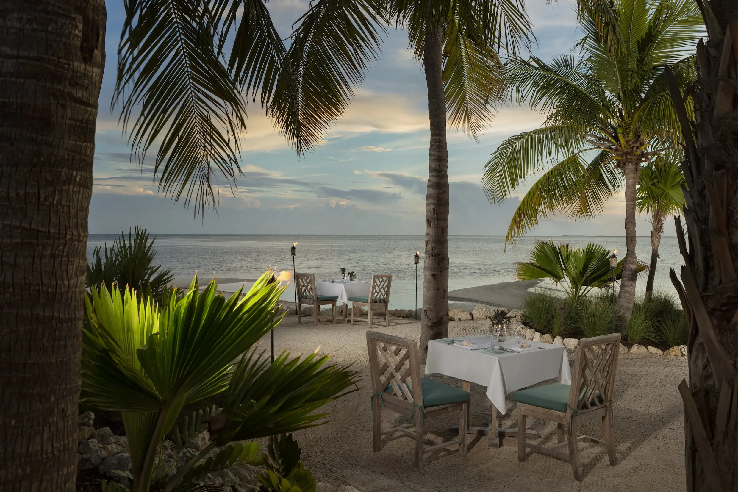 A private dining experience on the oceanfront beach of Little Palm Island