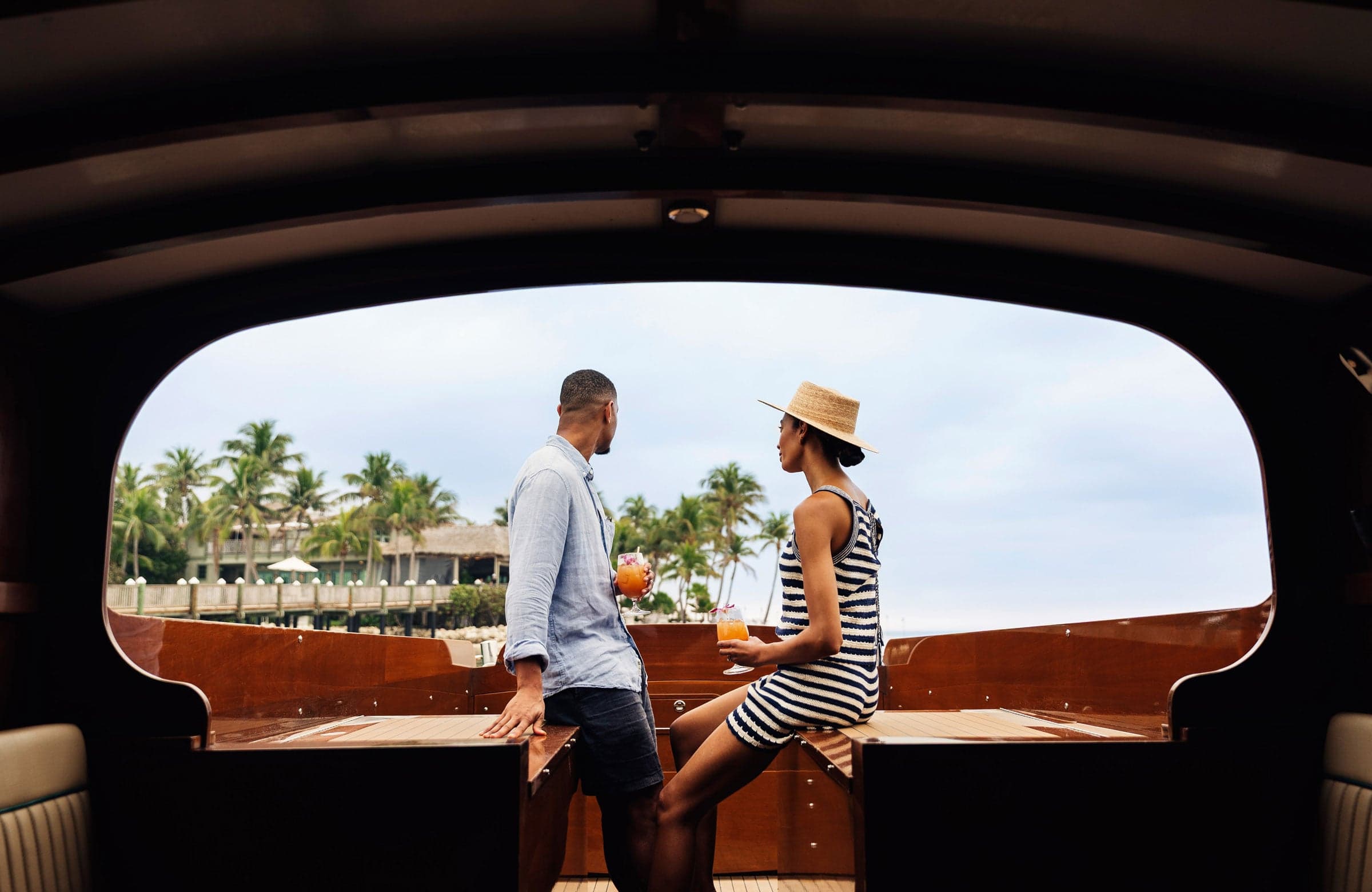 Couple With Drinks On A Boat